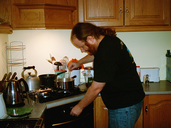 kevin tries to rescue dinner from an excess of water.