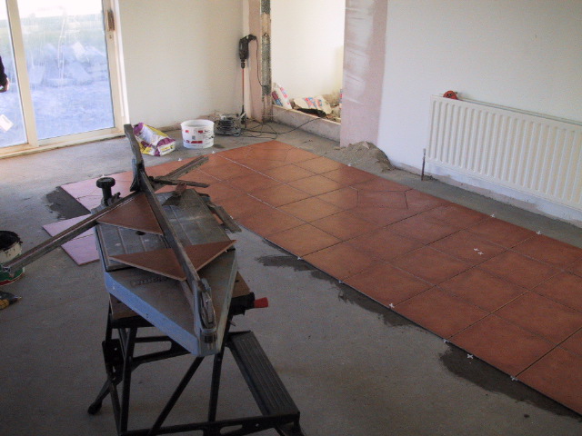 Back corener of kitchen looking across and out the sliding glass doors.