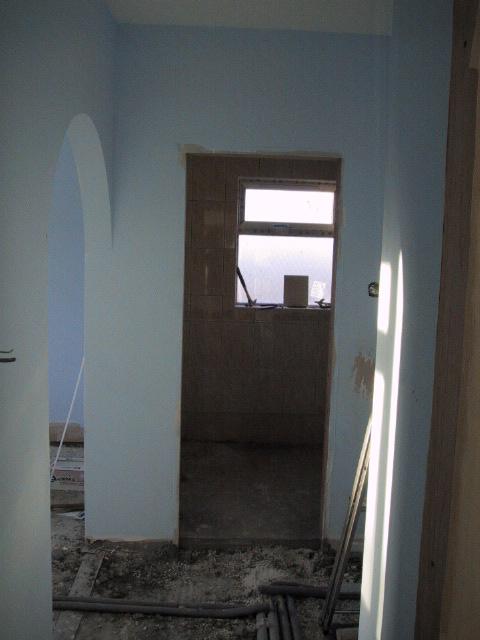 Looking down hall into en suite.