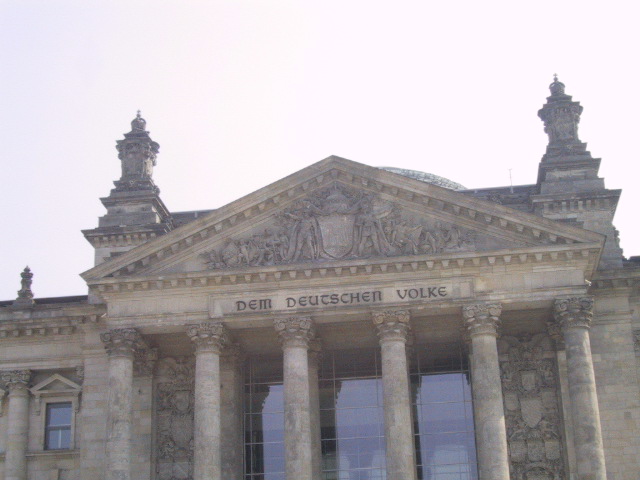 "For the German people."  If i read correctly, they're not engraved.  They're bronze letters attached to the stone.