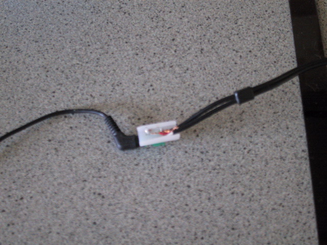 The connection.  i took out the connector from a broken portable radio.  it's a piece of plastic with two metal tabs.  one tab contacts the tip of the headphone jack.  the other touches the base.  the middle bit of the headphone jack isn't touched even though it looks electrically isolated.  anyone can feel free to explain that.